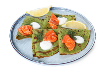 Tasty spinach crepes with salmon, sour cream, dill and lemon isolated on white
