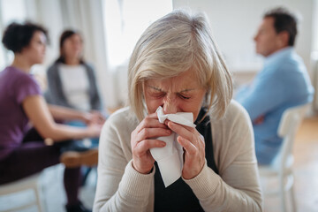 Woman finding support during group therapy.