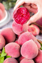 Fresh Chinese Blood Peaches from Hubei Cut Open in Hand
