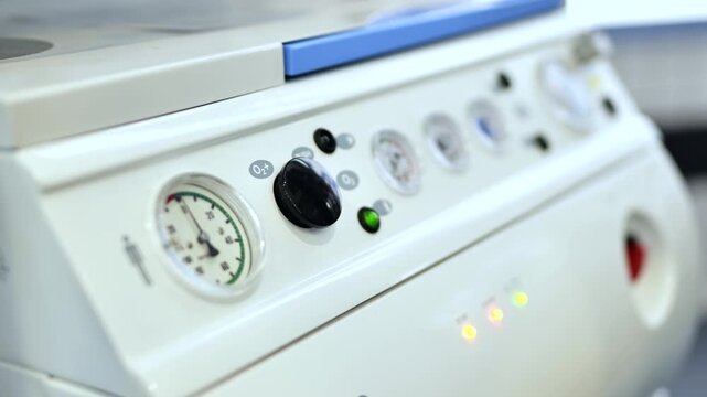 Medical equipment panel with pressure gauge showing healthcare technology concept