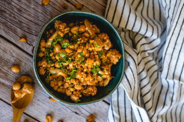 homemade recipe for chickpeas with cauliflower curry spices home table