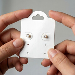 earring card mockup being held