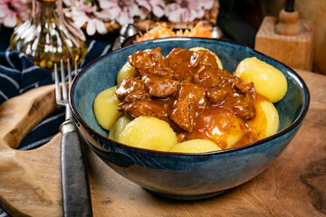 Beef stew in gravy, served with silesian dumplings.