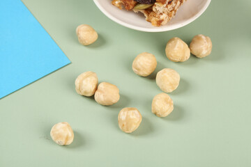 Roasted Hazelnuts Flat Lay on Mint Green Background