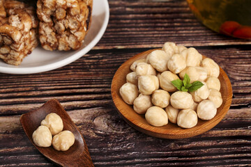 Roasted Cashews and Mixed Nuts on Wooden Table