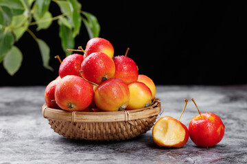 Fresh Red Apples in Woven Basket with Green Leaves