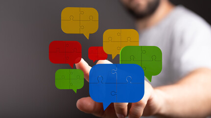 A vibrant display showing colorful speech bubbles made of puzzle pieces being touched, symbolizing communication.