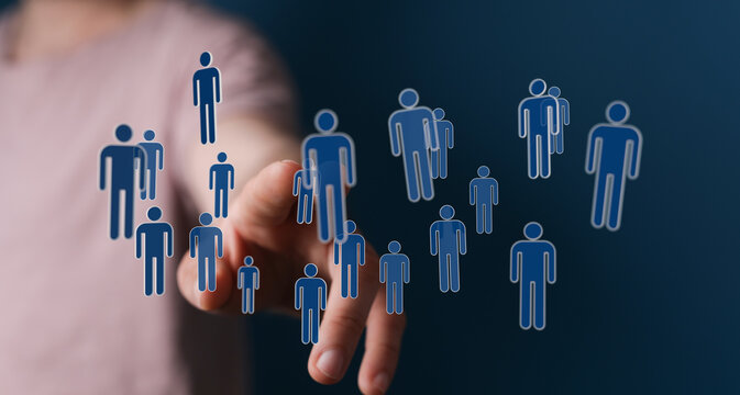 Hand reaching out to connected human icons, representing social networking, teamwork and communication in the d