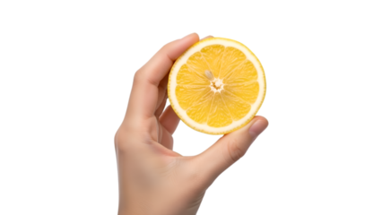 Hand holding a half lemon slice on black background