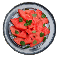 Round blue plate with sliced ​​watermelon pieces on isolated background, top view