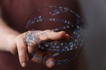 Abstract image of a hand interacting with a digital sphere, symbolizing data processing and the internet.
