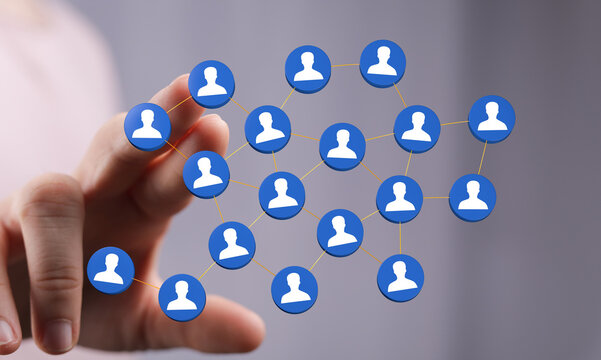 Abstract network of people with hand touching the digital icons representing human connections and future - Powered by Adobe