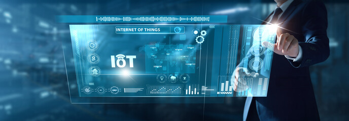 Businessman analyzing IoT data on virtual interface connected devices, sensor networks, real-time monitoring, smart automation, digital ecosystem.