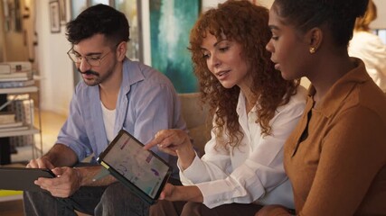 Diverse creative team collaborating using digital tablets - Powered by Adobe