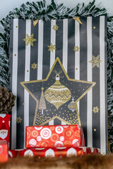 an image of colourful Christmas gifts wrapped in festive decorations and covered in tinsel 