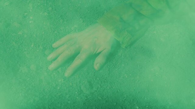 Toxic Green Smoke Over Person On The Ground