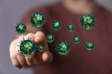 Concept of health and disease, digital visualization of coronavirus floating with a hand, touching the virus f