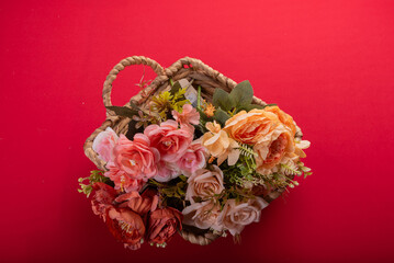 Minimal floral arrangement on red surface