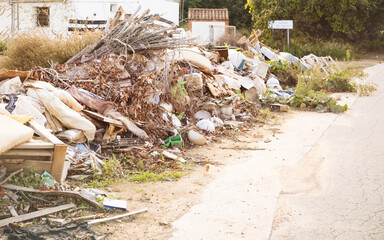 Debris outside houses due to a flash flood in Spain