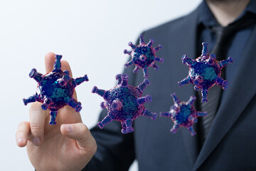 Business man trying to stop the spread of virus particles. Concept of preventing disease. The risk of pandemic