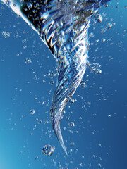 Underwater Spiral Twirl With Air Bubbles, Crystal Blue Ocean Light, and Dynamic Reflections