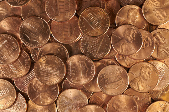 Close up of a collection of pennies. Seven times actual size. Copper pennies.


