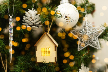 A small wooden house on a Christmas tree