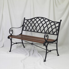 Classic wooden park bench with ornate cast iron frame
