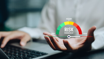 Risk management concept, hand presenting virtual risk gauge from low to high level, business risk assessment control, operational exposure analysis, enterprise decision support system.
