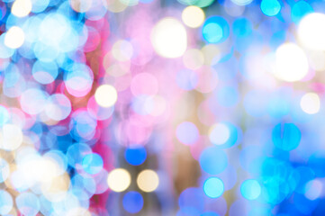 Obraz premium A soft, out-of-focus collage of blue, pink, and warm lights creates a dynamic, festive atmosphere. Ideal as a decorative background for events, promotions, or technology and lifestyle themes.