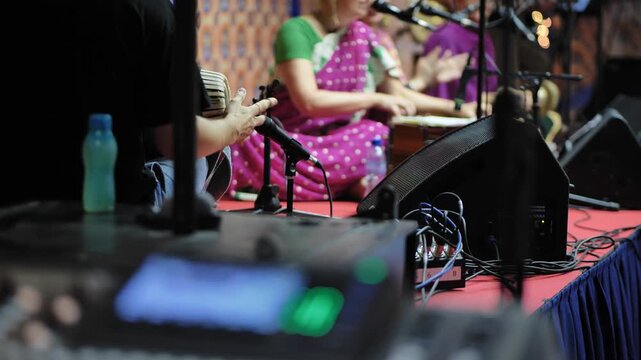 Musicians performing Indian festival Ganesha devotional music on stage