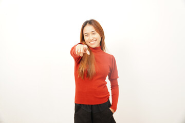 Happy young woman smiling and confidently pointing her index finger directly at the camera, choosing or addressing the viewer