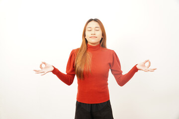 Calm young woman meditating with closed eyes and hands in Gyan Mudra (OK) position, seeking focus and inner peace.