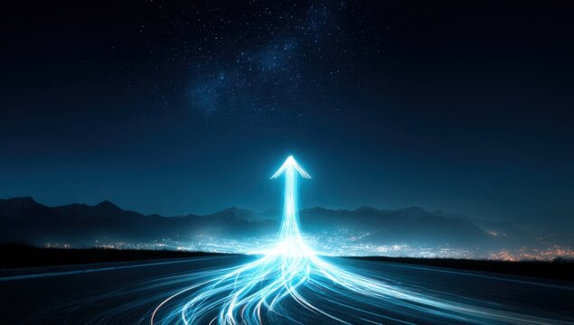 light in the shape of an arrow on a road at night