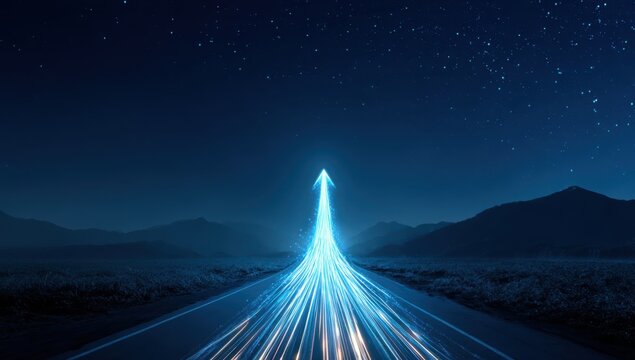 light in the shape of an arrow on a road at night