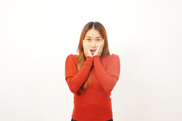 Shocked young woman with hands on her cheeks and mouth slightly open, expressing extreme surprise or disbelief