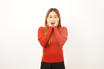 Shocked young woman with hands on her cheeks and mouth slightly open, expressing extreme surprise or disbelief