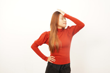 Frustrated young woman performing a facepalm gesture, expressing mistake, regret, embarrassment, or failure.