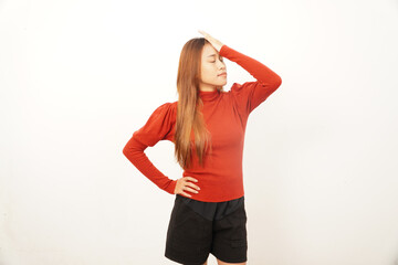 Frustrated young woman performing a facepalm gesture, expressing mistake, regret, embarrassment, or failure.