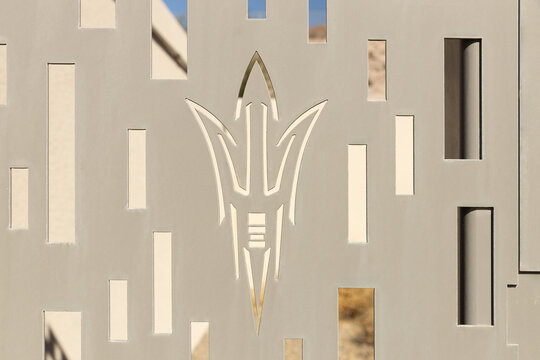 Tempe, AZ, USA - October 28, 2023: The Arizona State University Sun Devils logo on a fence outside of Mountain America Stadium,  the schools football stadium.