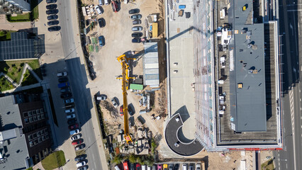Aerial View of Construction Site with Crane and Building