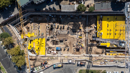 Aerial View of Construction Site with Cranes