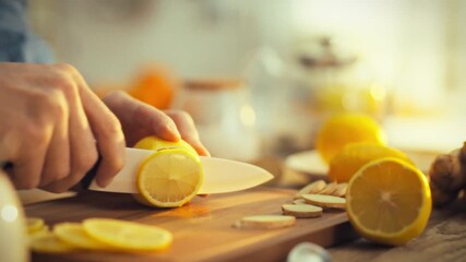 Male hands firmly hold ceramic knife, slicing into bright lemon on wooden board amidst medley citrus fruits blurred background, releasing juice with contrasting texture captured in detailed macro shot - Powered by Adobe