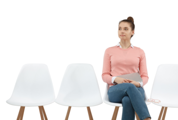 Confident successful young woman holding digital tablet while waiting for meeting, sitting on chair