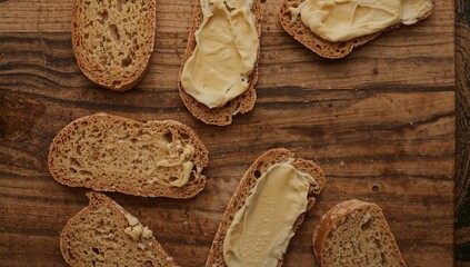 Rustic Bread and Butter Flat Lay on Wooden Board, Top View