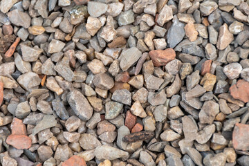 The detailed texture of gravel and small stones as a natural backdrop for design and architecture
