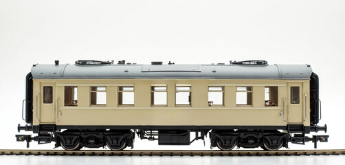 Classic train carriage exterior view on white background. Detailed model shows windows, doors, wheels, and roof vents. Ideal for educational content and historical context.