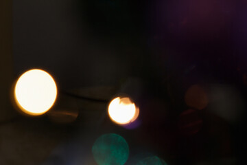 Abstract dark background with colorful bokeh lights