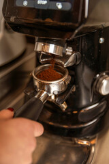 Professional barista preparing perfect cappuccino in the cafe bar