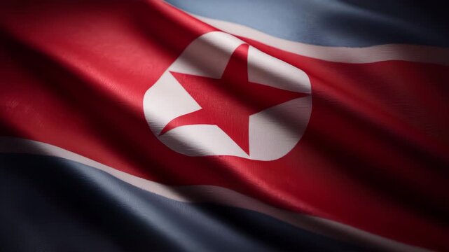 波打つ北朝鮮国旗の布地を質感まで捉えたクローズアップ